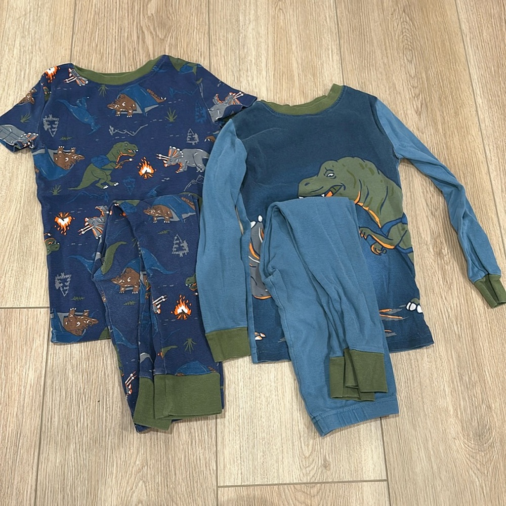 Two sets of dinosaur pajamas Kirkland size 7